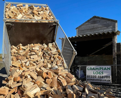 Tipped trailer unloading seasoned firewood at Grampian Logs